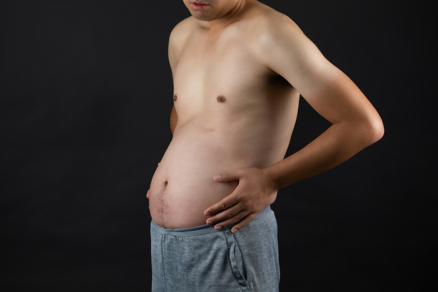 1778073082 pincture of man with largee belly to show candidate for stomach or abdominal liposuction
